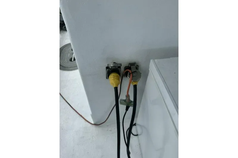 Annabel C Yacht Photos Pics Electrical connections on a Monroe Custom 52, 1987 model, with visible cables and plugs.