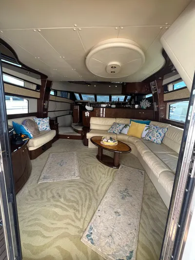  Yacht Photos Pics Luxurious interior of 2005 Neptunus 62 Flybridge yacht with elegant seating and decor.