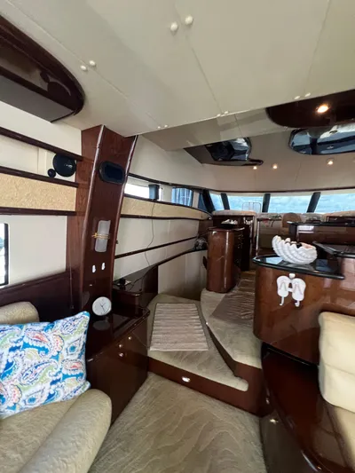  Yacht Photos Pics Luxurious interior of 2005 Neptunus 62 Flybridge yacht with elegant wood finishes.