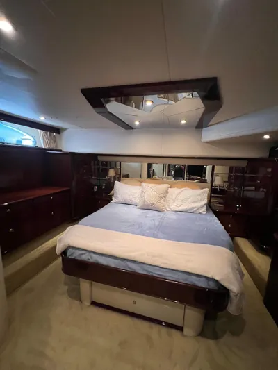  Yacht Photos Pics Luxurious bedroom interior of 2005 Neptunus 62 Flybridge yacht with elegant bedding.