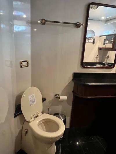  Yacht Photos Pics Luxurious bathroom in 2005 Neptunus 62 Flybridge yacht with modern amenities.