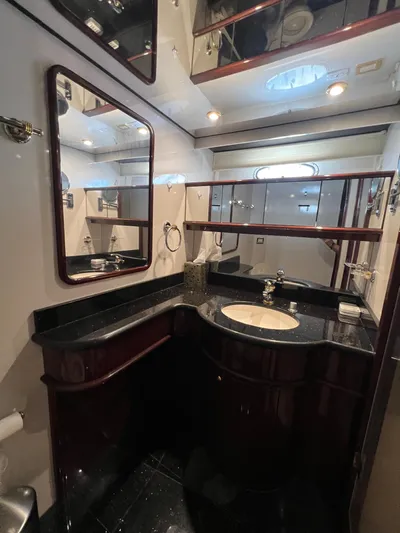  Yacht Photos Pics Luxurious bathroom in 2005 Neptunus 62 Flybridge yacht with elegant fixtures and mirrors.