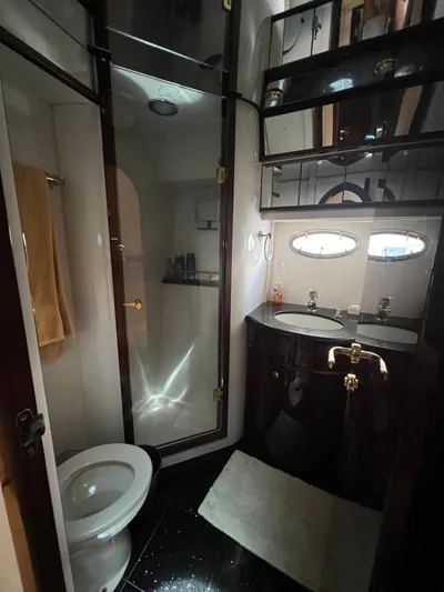  Yacht Photos Pics Luxurious bathroom in 2005 Neptunus 62 Flybridge yacht with modern fixtures.