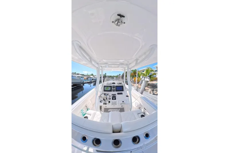  Yacht Photos Pics 2014 Intrepid 327 Center Console boat interior with modern dashboard and seating.