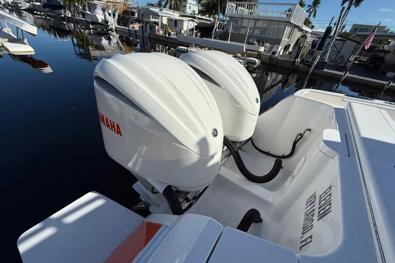  Yacht Photos Pics 2014 Intrepid 327 Center Console with twin Yamaha outboard engines docked at marina.