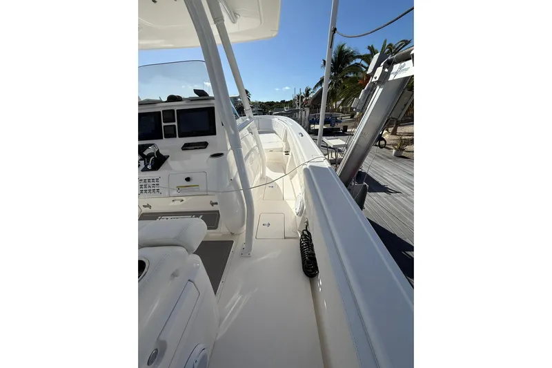  Yacht Photos Pics 2014 Intrepid 327 Center Console boat interior with helm and seating area.