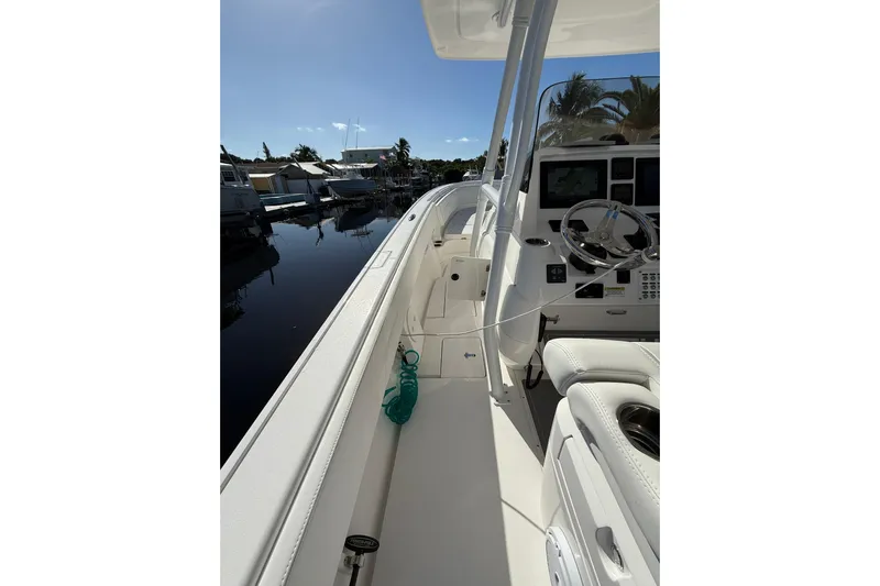  Yacht Photos Pics 2014 Intrepid 327 Center Console boat interior with steering wheel and controls.