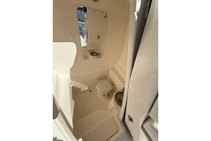 Yacht Photos Pics 2014 Intrepid 327 Center Console boat interior with toilet and sink.