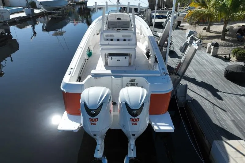  Yacht Photos Pics 2014 Intrepid 327 Center Console boat with twin 300 V6 engines docked at marina.