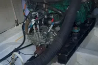 Engine compartment of a 2015 Sas-Vektor 950 boat, showcasing mechanical components and hoses.