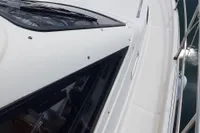 Sas-Vektor 950 yacht, 2015 model, docked in a marina with surrounding boats.