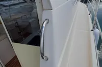 Side view of a 2015 Sas-Vektor 950 boat docked at a marina.