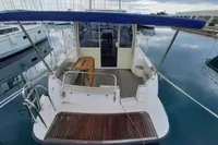 Sas-Vektor 950 yacht, 2015 model, docked with blue canopy and wooden deck.