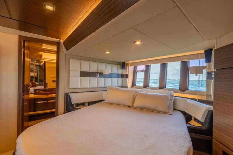 Prime Time II Yacht Photos Pics Luxurious bedroom interior of 2016 Azimut 64 Flybridge yacht with ocean view.