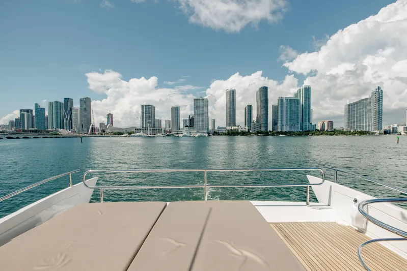 Prime Time II Yacht Photos Pics Azimut 64 Flybridge 2016 yacht with city skyline view on a sunny day.