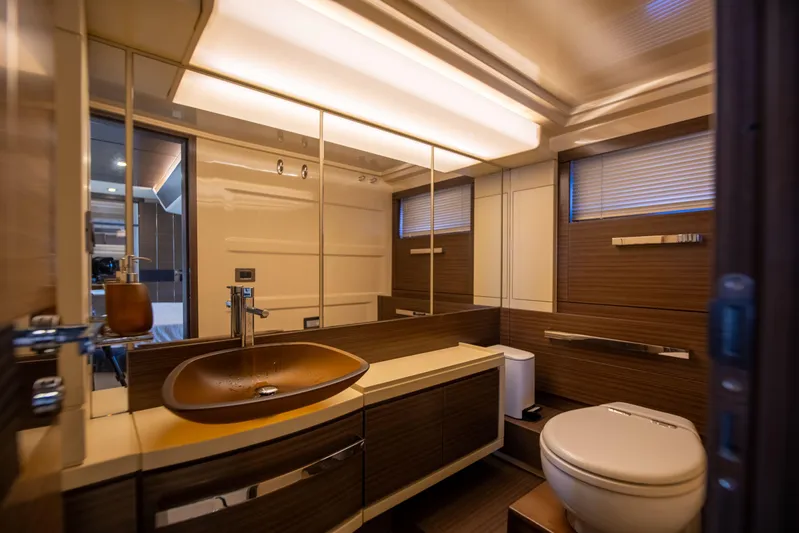 Prime Time II Yacht Photos Pics Luxurious bathroom interior of 2016 Azimut 64 Flybridge yacht with modern fixtures and elegant design.