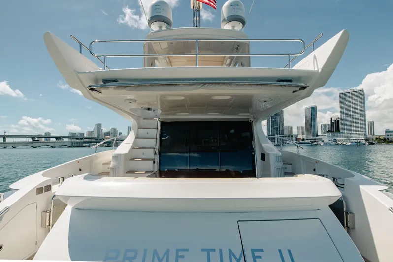 Prime Time II Yacht Photos Pics Luxury 2016 Azimut 64 Flybridge yacht docked with city skyline in background.
