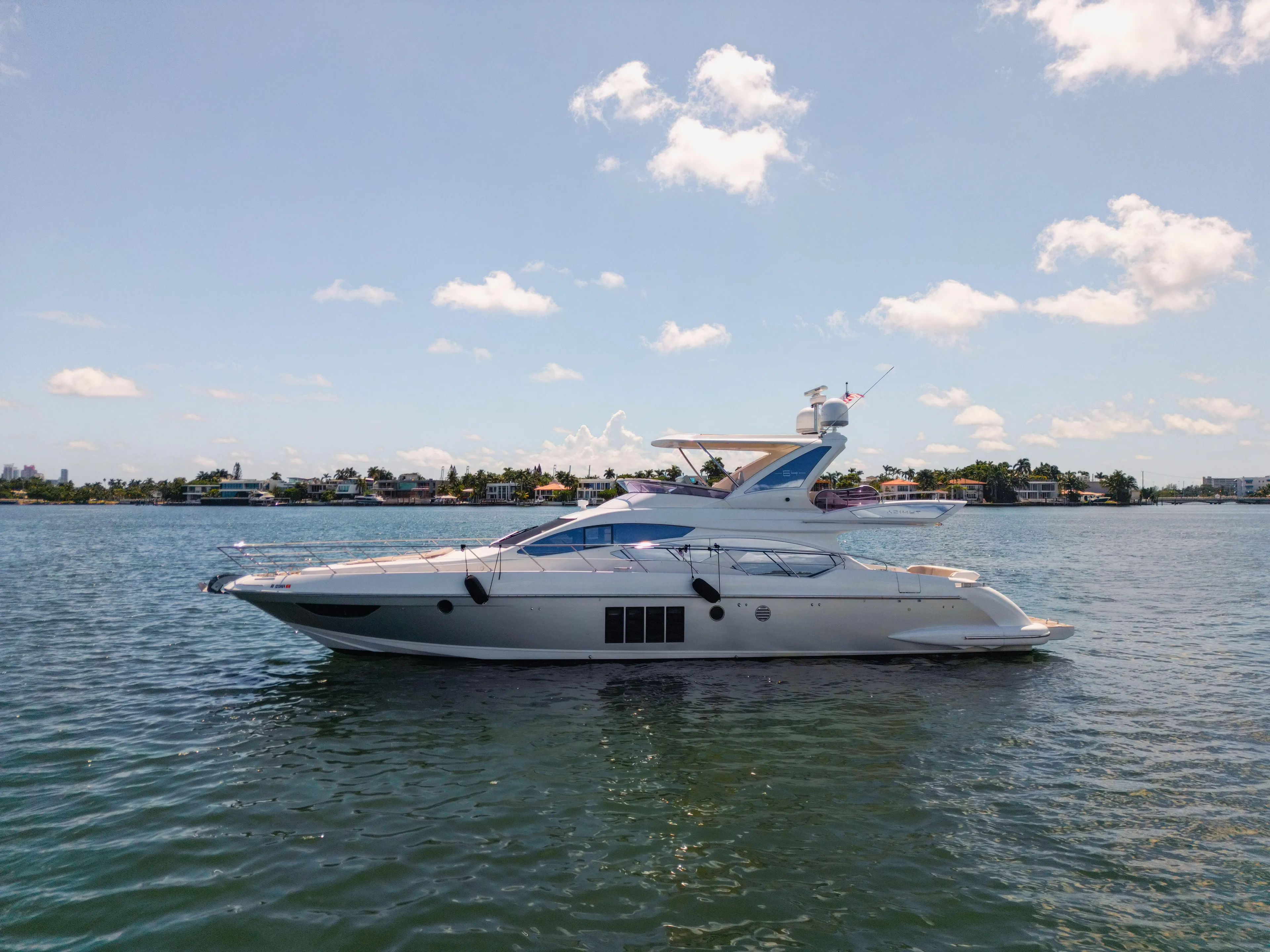 Prime Time II Yacht Photos Pics 2016 Azimut 64 Flybridge yacht cruising on a sunny day.