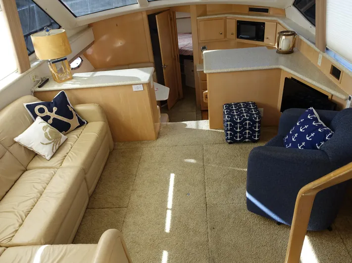  Yacht Photos Pics Interior of 2000 Carver 406 Aft Cabin Motor Yacht with cozy seating and nautical decor.
