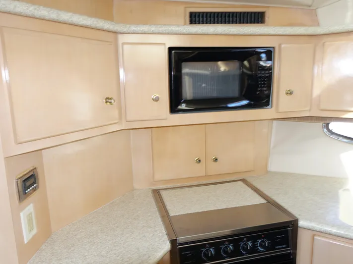  Yacht Photos Pics 2000 Carver 406 Aft Cabin Motor Yacht kitchen with microwave and stove.