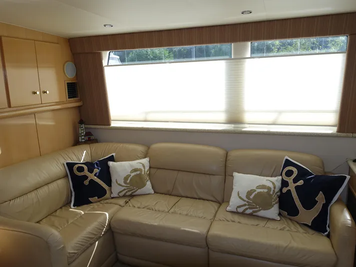  Yacht Photos Pics Luxurious interior of 2000 Carver 406 Aft Cabin Motor Yacht with nautical-themed pillows.