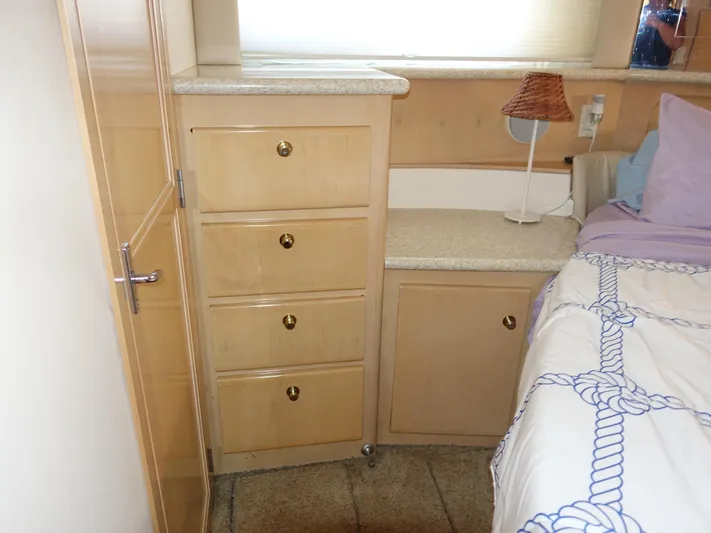  Yacht Photos Pics Interior of 2000 Carver 406 Aft Cabin Motor Yacht with wooden drawers and bed.