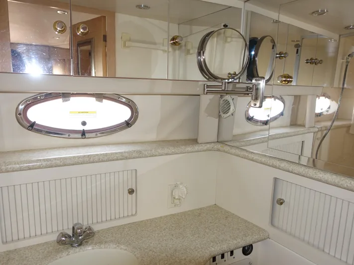  Yacht Photos Pics Luxurious bathroom in 2000 Carver 406 Aft Cabin Motor Yacht with mirrored cabinets.