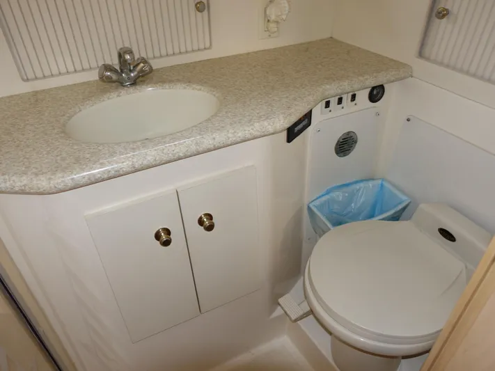  Yacht Photos Pics Bathroom interior of 2000 Carver 406 Aft Cabin Motor Yacht with sink and toilet.