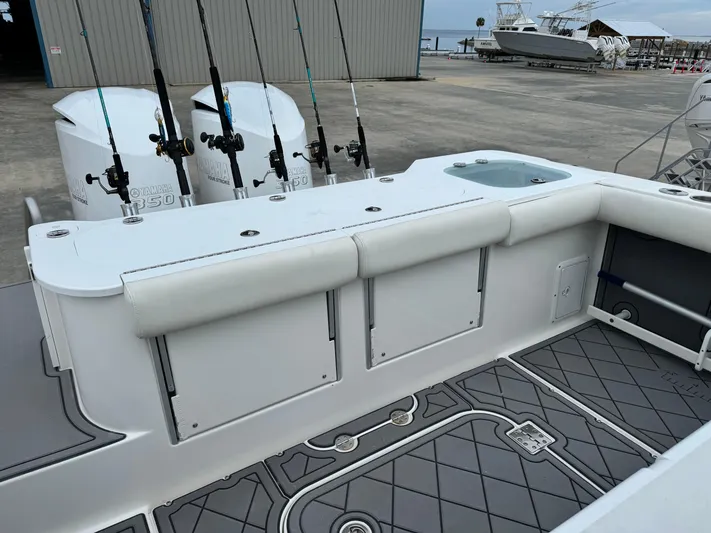  Yacht Photos Pics 2008 Everglades 320CC boat with fishing rods and dual engines at a marina.