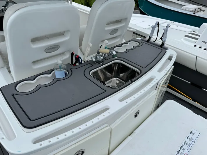  Yacht Photos Pics 2008 Everglades 320CC boat interior with sink and seating area.