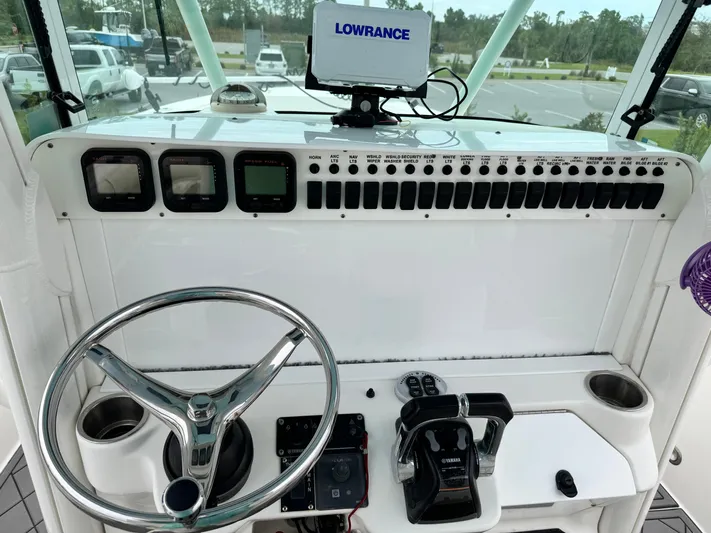  Yacht Photos Pics 2008 Everglades 320CC boat dashboard with Lowrance navigation system and steering wheel.