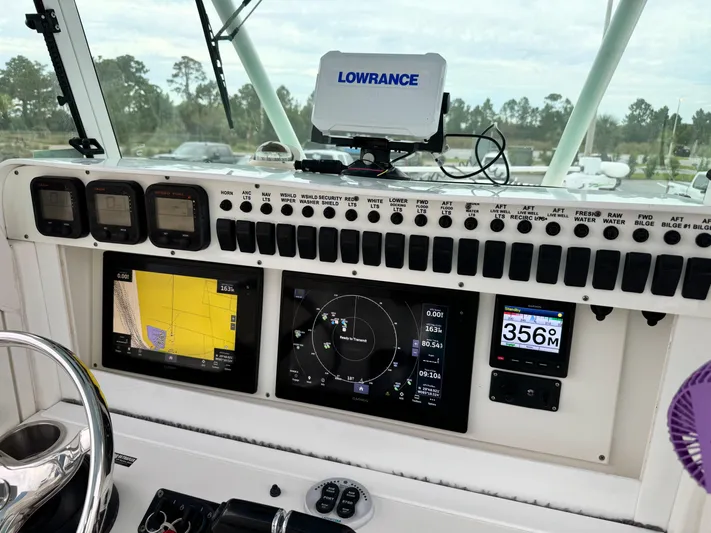  Yacht Photos Pics Control panel of 2008 Everglades 320CC boat with navigation displays and Lowrance equipment.