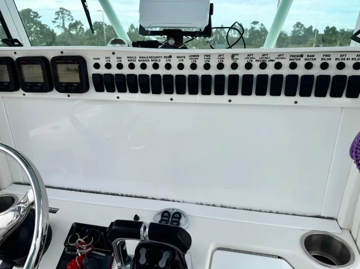  Yacht Photos Pics Control panel of a 2008 Everglades 320CC boat with various switches and gauges.