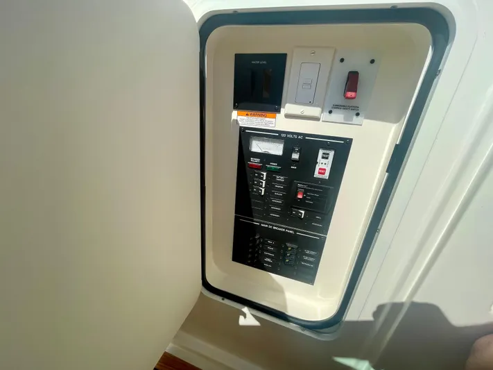 Honey Yacht Photos Pics Electrical panel inside 2019 Sea Ray SLX 310 boat, featuring switches and controls.