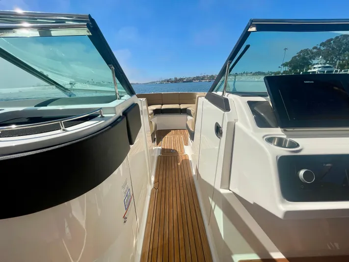 Honey Yacht Photos Pics 2019 Sea Ray SLX 310 boat interior with sleek design and wooden flooring.