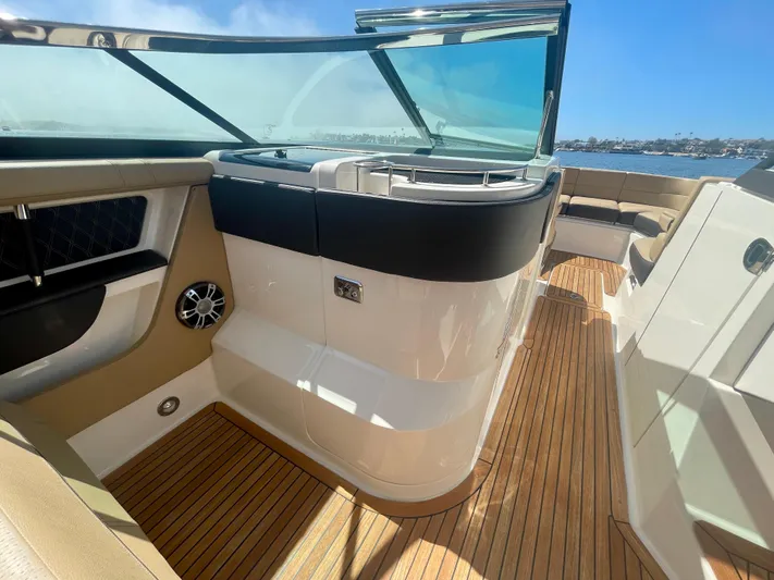 Honey Yacht Photos Pics 2019 Sea Ray SLX 310 boat interior with teak flooring and sleek design.