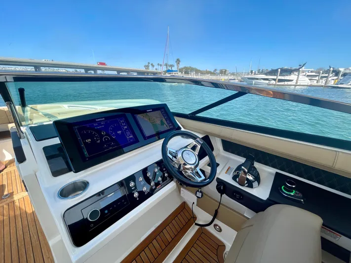 Honey Yacht Photos Pics 2019 Sea Ray SLX 310 helm with modern controls and scenic marina view.