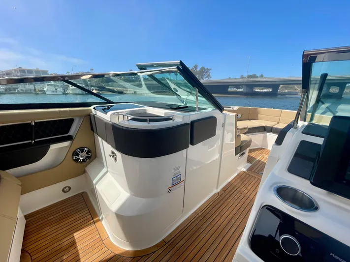 Honey Yacht Photos Pics 2019 Sea Ray SLX 310 boat interior with sleek design and wooden flooring.