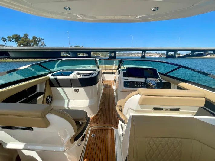 Honey Yacht Photos Pics 2019 Sea Ray SLX 310 boat interior with luxurious seating and modern dashboard.