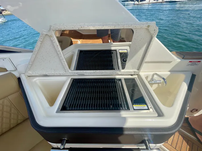 Honey Yacht Photos Pics Outdoor kitchen on 2019 Sea Ray SLX 310 boat with grill and sink.