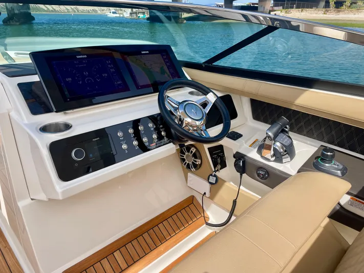 Honey Yacht Photos Pics 2019 Sea Ray SLX 310 helm with modern controls and dual displays on a sunny day.