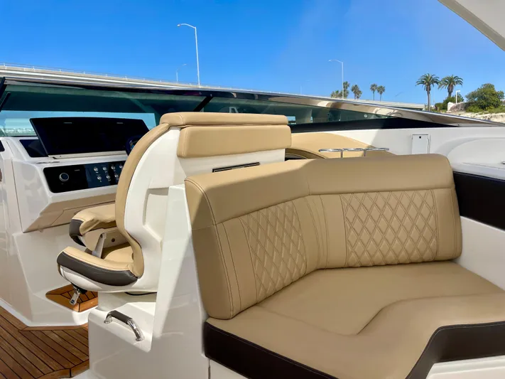 Honey Yacht Photos Pics 2019 Sea Ray SLX 310 boat interior with beige leather seating and modern dashboard.