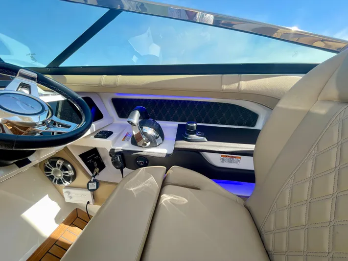 Honey Yacht Photos Pics Luxurious interior of 2019 Sea Ray SLX 310 boat with modern steering and controls.