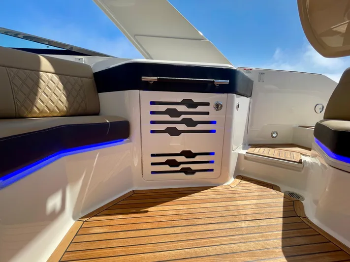 Honey Yacht Photos Pics 2019 Sea Ray SLX 310 interior with wood flooring and modern seating.