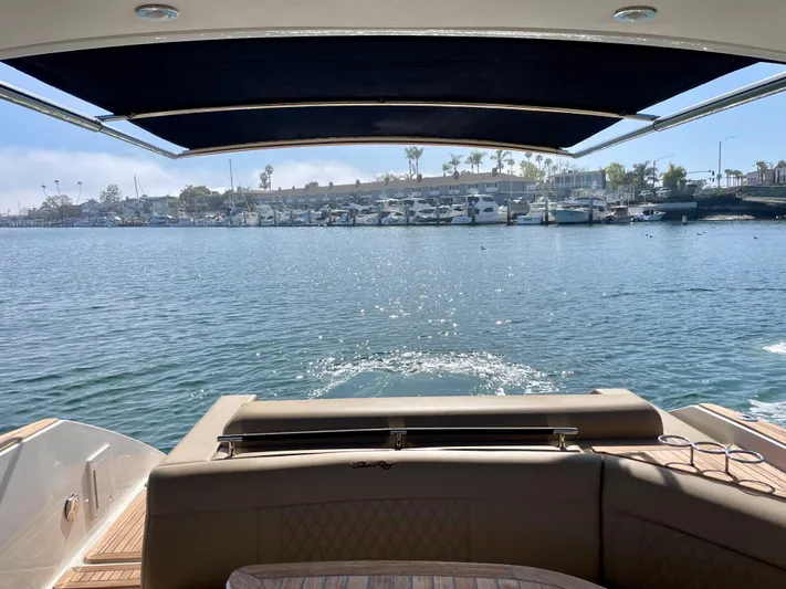 Honey Yacht Photos Pics 2019 Sea Ray SLX 310 boat with waterfront view and marina in the background.