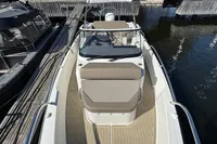2020 Nimbus T8 boat docked at marina, featuring sleek design and spacious seating.