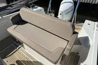 Nimbus T8 2020 boat with beige seating and Mercury outboard motor.