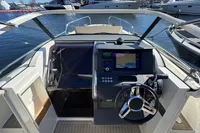 Cockpit of 2020 Nimbus T8 boat with modern navigation system, docked at marina.