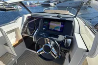 Cockpit of 2020 Nimbus T8 boat with modern navigation system and steering wheel.