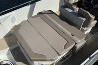 Nimbus T8 2020 boat interior with beige cushioned seating and sleek design.
